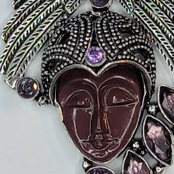 Sterling Silver Pendant with Brown Carved Face, Blue Topaz, and Feather Motif - Picture 12 of 13